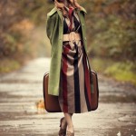 Style redhead girl with suitcase at beautiful autumn alley.